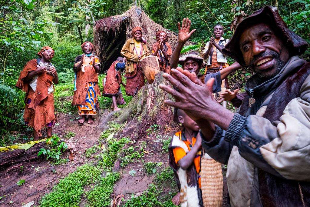 Batwa community members demonstrating traditional forest life near Bwindi.