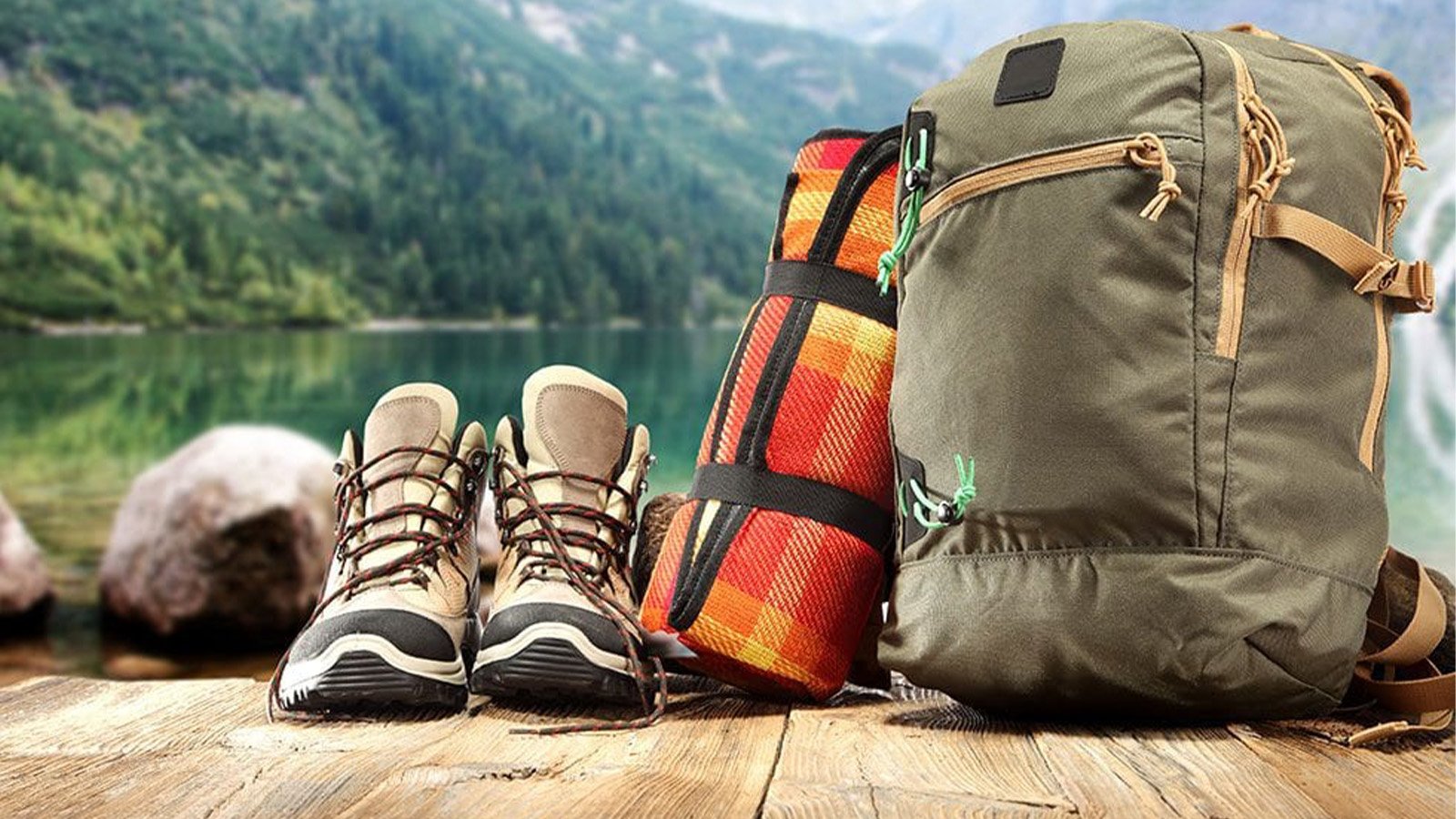 Best Gorilla Trekking Packing List 5 Backpack containing gorilla trekking essentials including water bottle, camera, rain jacket, and personal items