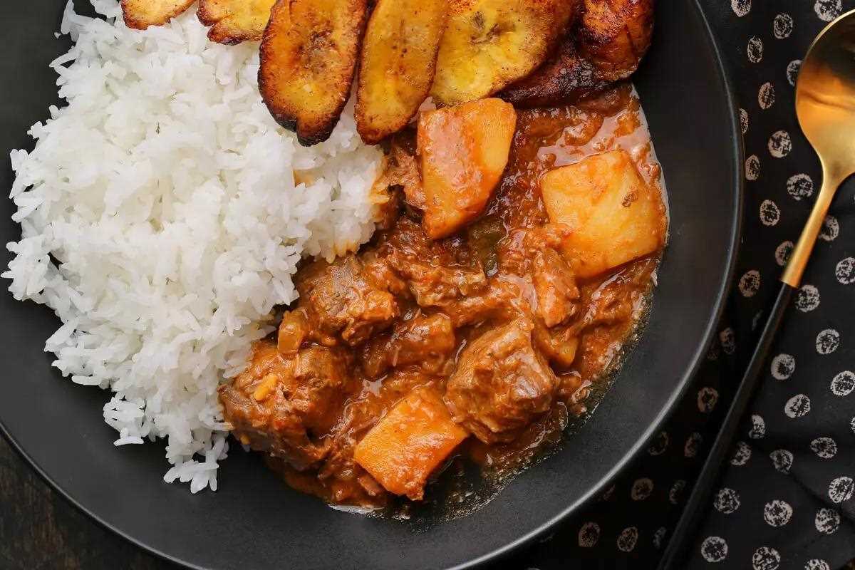 Uganda Food Guide 73 Pumpkin and groundnut stew served with rice and plantain