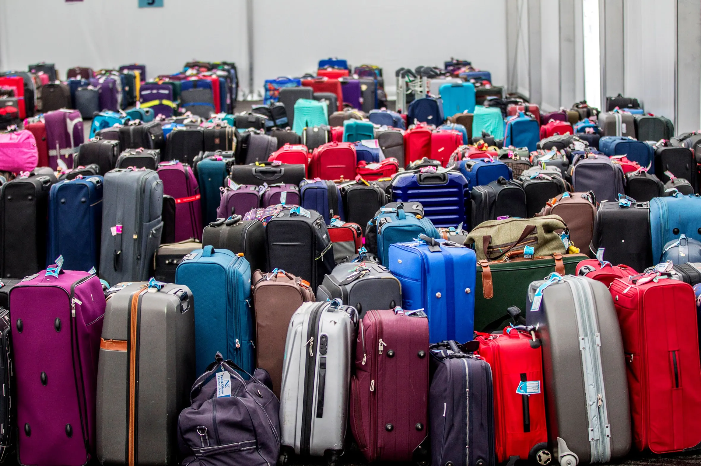 Ultimate Uganda Airport Guide: Best Travel Tips (2026/2027) 5 Large collection of passenger suitcases representing baggage collection and lost luggage services at Entebbe International Airport in Uganda