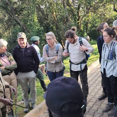 Nkuringo Gorilla Trekking Guide 7 Trekking tourists listening to a park ranger briefing at Nkuringo headquarters