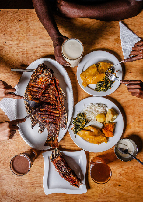 Uganda Food Guide 109 Ugandan meal with whole tilapia and several staple food accompaniments