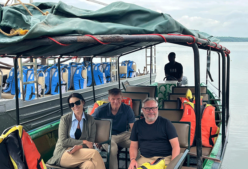 Incredible Uganda Wildlife Encounters: Ultimate Safari Guide 2026/2027 41 Travelers seated in a safari boat during a Kazinga Channel wildlife cruise in Queen Elizabeth National Park, Uganda