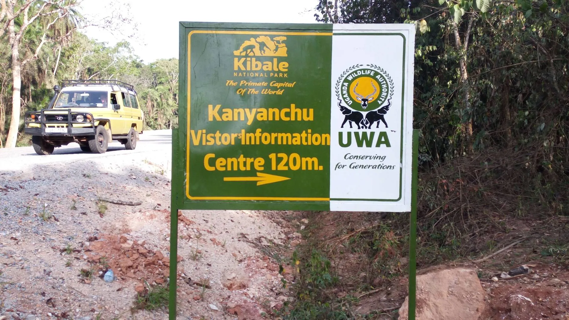 Rwanda vs Uganda Safari: Which Is Best? 2026/2027 21 Kibale National Park Kanyanchu Visitor Information Centre sign with safari vehicle, representing Uganda’s leading chimpanzee and primate safari destination