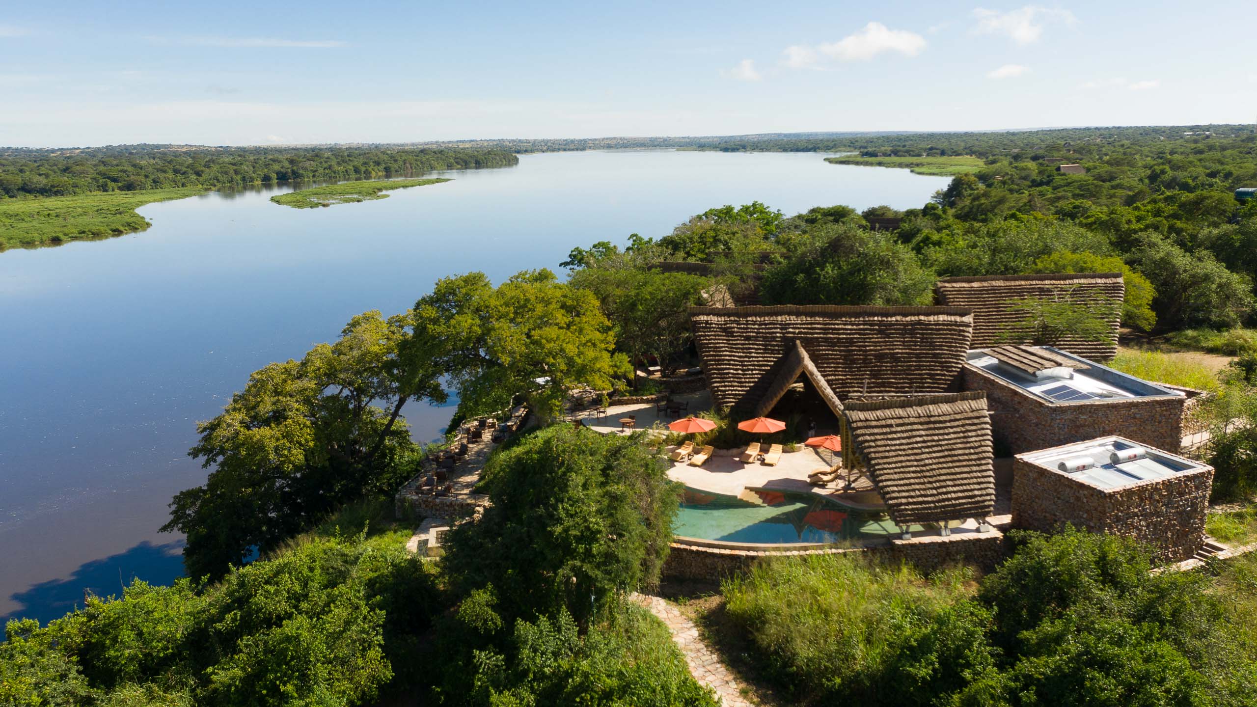 Best Uganda Luxury Holidays 2026/2027: Ultimate Safari Guide 29 Luxury safari lodge overlooking the Nile River and lush wilderness in Murchison Falls National Park, Uganda