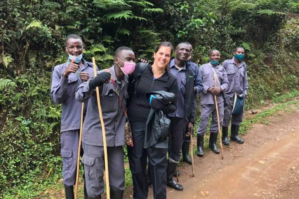 kigali city tour 31 A gorilla trekker posing with experienced guides and porters before a mountain gorilla trekking adventure in Volcanoes National Park, Rwanda.