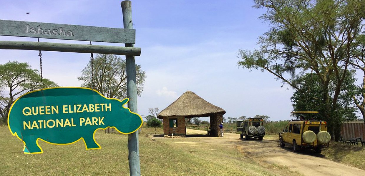 Rwanda vs Uganda Safari: Which Is Best? 2026/2027 17 Entrance to the Ishasha Sector of Queen Elizabeth National Park in Uganda with safari vehicles and park signage