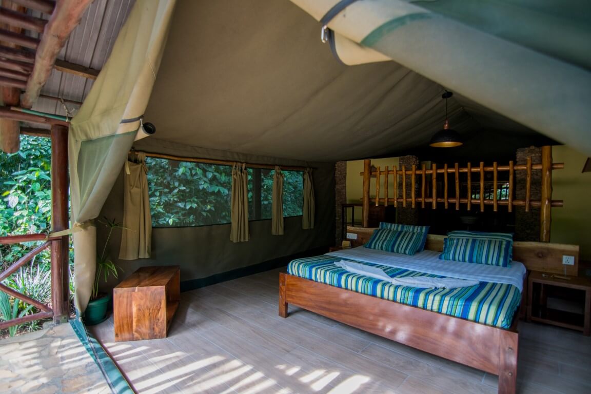 Self-Contained Kibale Forest Camp Tent Self-contained safari tent room with comfortable bed at Kibale Forest Camp