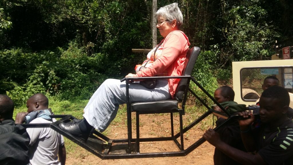 Ultimate Gorilla Trekking for Seniors 7 Sedan chair carrying senior gorilla trekker in Bwindi Impenetrable Forest