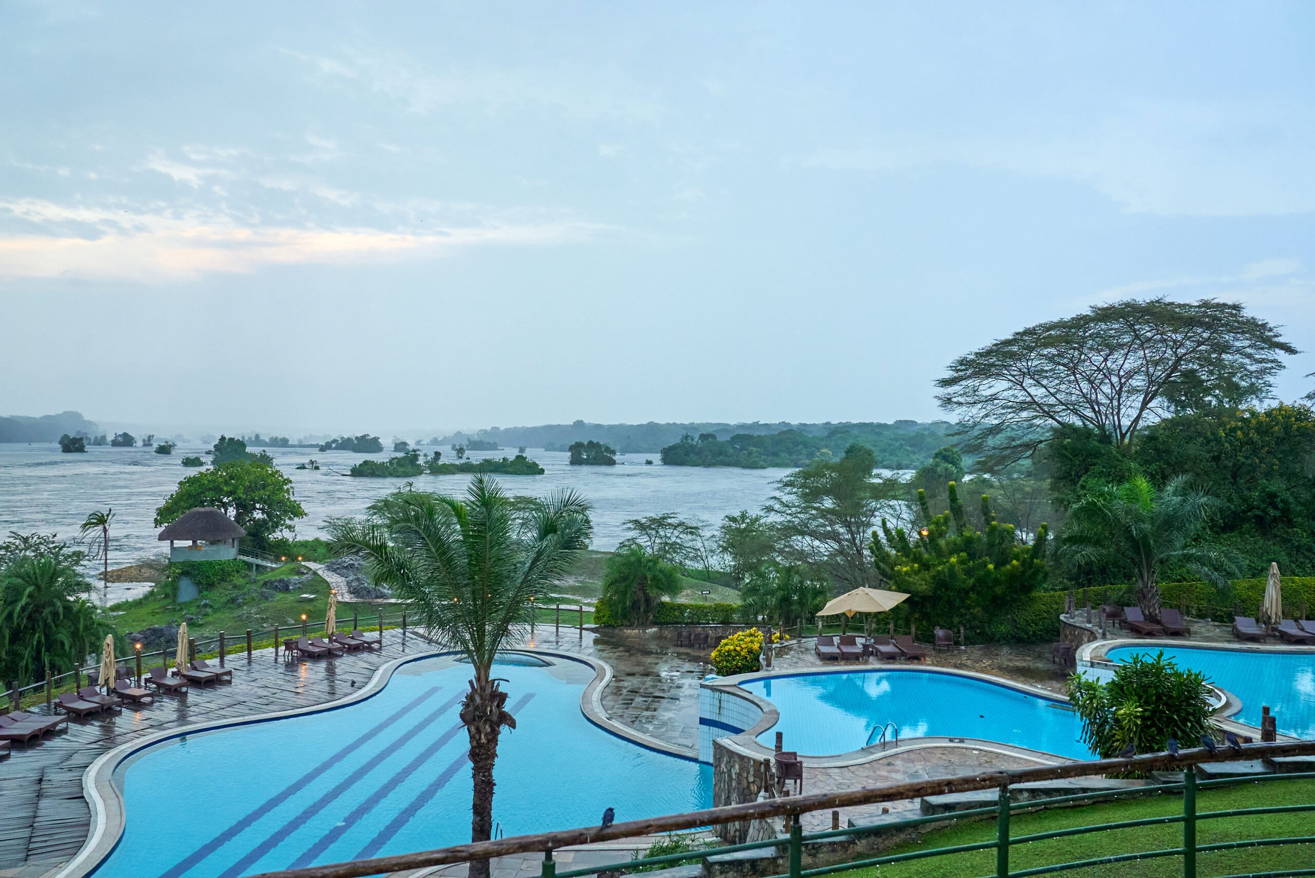 Best Uganda Luxury Holidays 2026/2027: Ultimate Safari Guide 3 Safari Vacations and Travel Services Ltd 4x4 vehicle crossing open savannah during a private Uganda luxury holiday and wildlife safari
