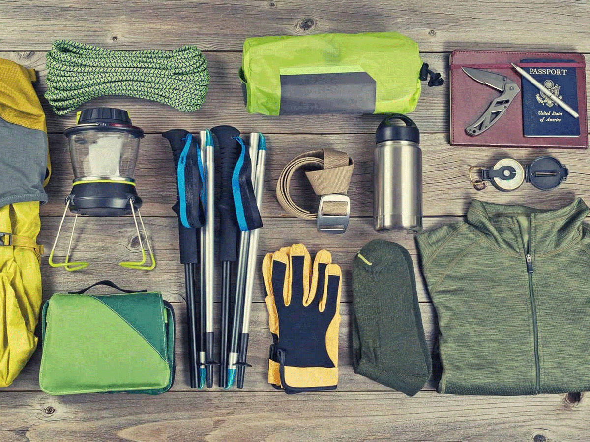 Rwanda Wildlife Guide: Best Safaris & Animals (2026/2027) 29 Safari packing essentials including trekking poles, gloves, warm clothing, water bottle, travel documents and outdoor gear for a Rwanda wildlife safari