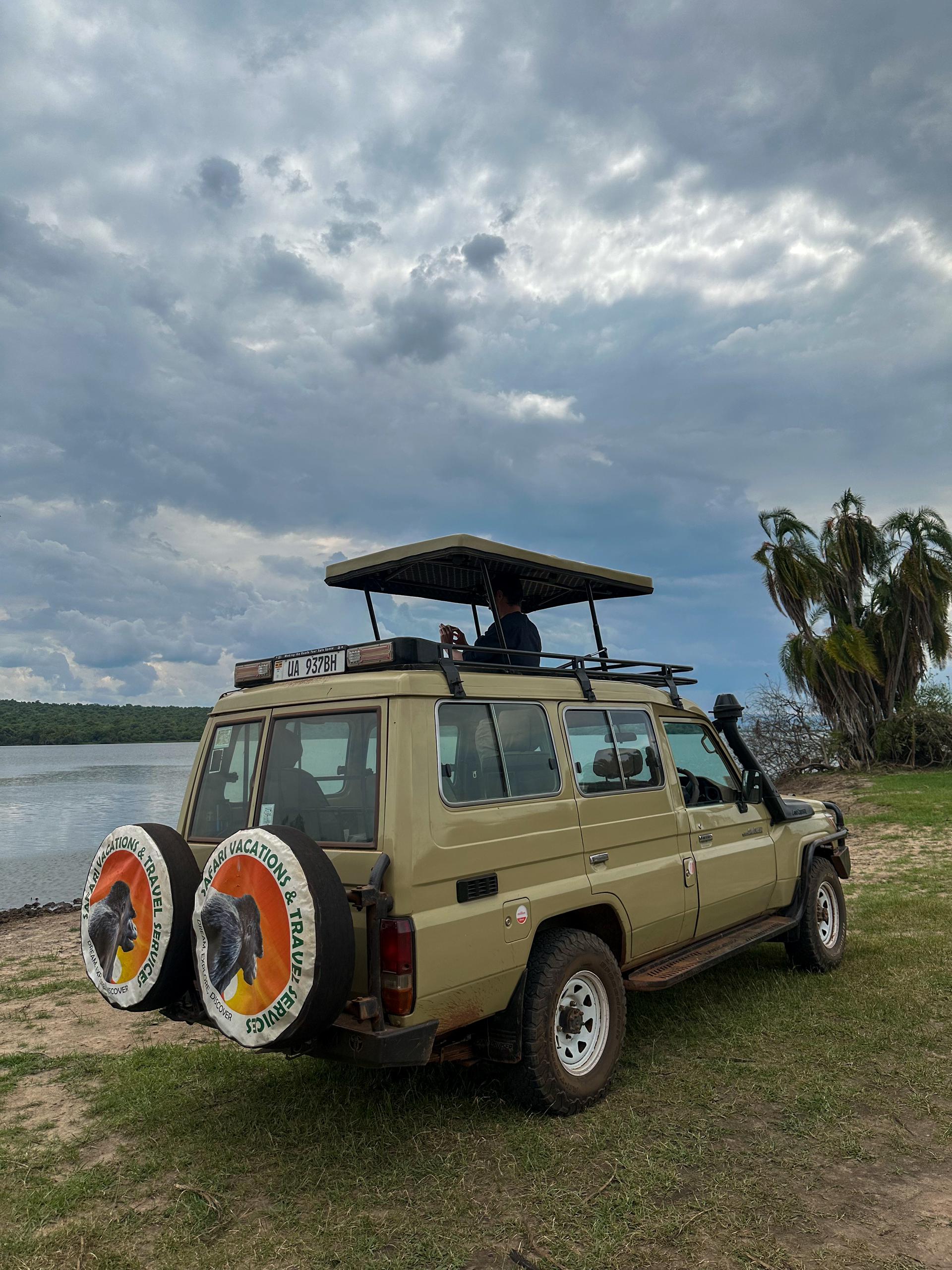 Uganda Safari in July 3 Safari vehicle observing wildlife in Uganda during July