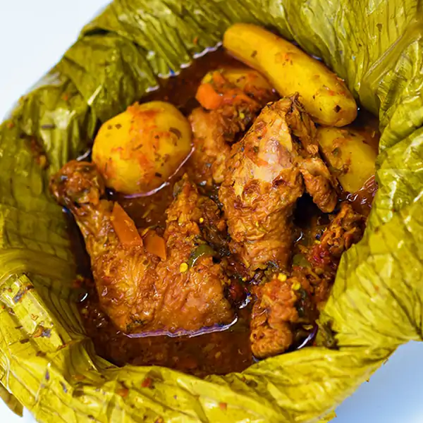 Uganda Food Guide 13 Traditional Ugandan chicken luwombo cooked inside banana leaves