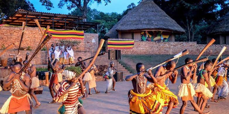 Uganda Culture Guide 37 Dancers playing long wooden horns at Ndere Cultural Centre, Uganda.