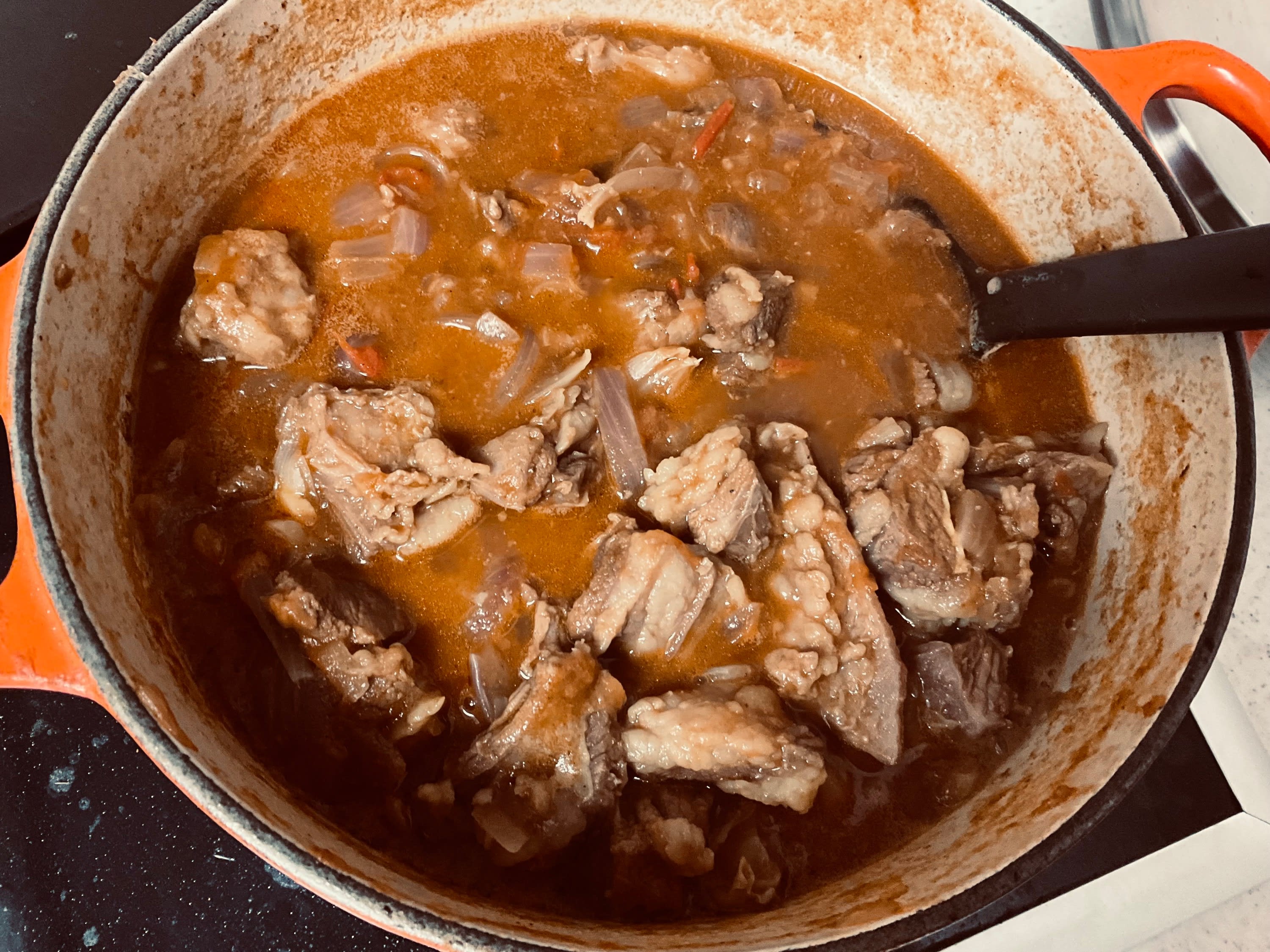 Uganda Food Guide 97 Ugandan style goat stew simmering with onions and tomatoes