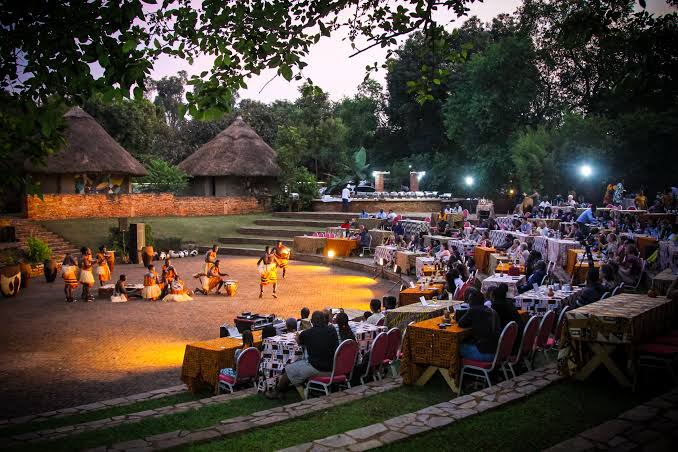 Uganda Culture Guide 21 Traditional dancers perform in an outdoor amphitheater at Ndere Centre.