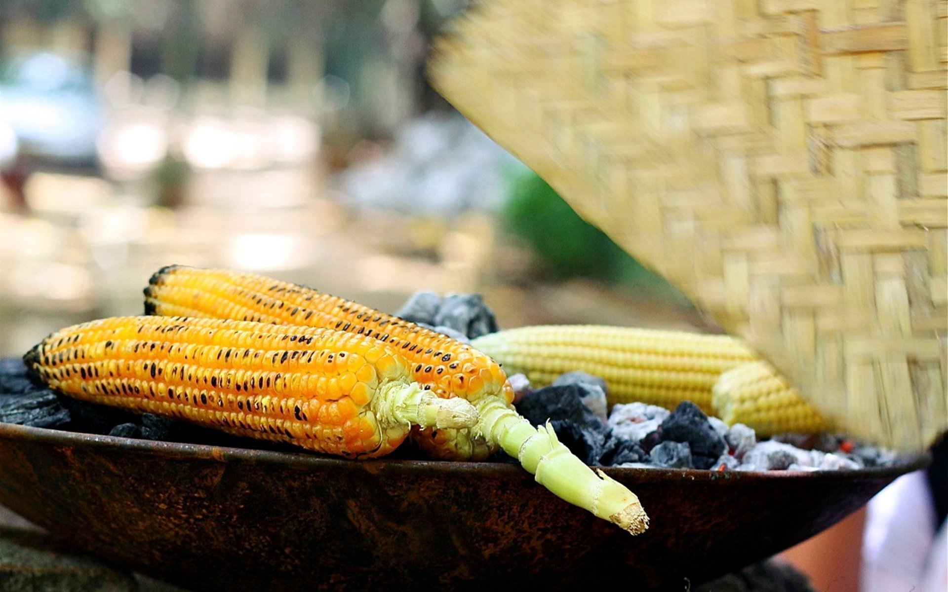 Uganda Food Guide 103 Fresh maize roasting over charcoal at an East African street stall
