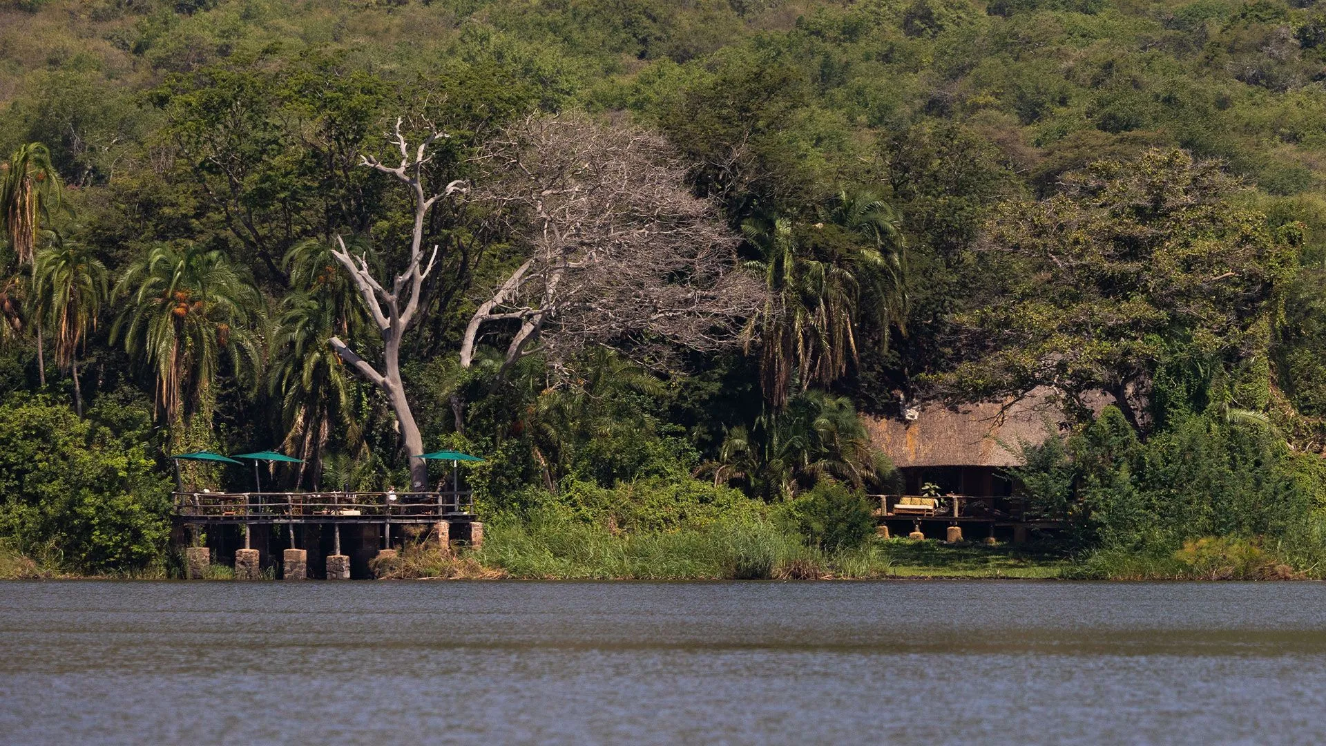 hatch lodge and wooden deck on Lake Ihema shoreline.