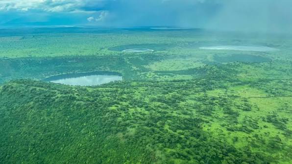 Queen Elizabeth National Park Guide 31 Aerial view of lush green volcanic crater lakes in Uganda.