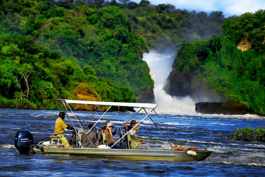 Murchison Falls Safari from China 3 Tourists enjoying a Nile boat safari toward Murchison Falls during a Murchison Falls Safari from China