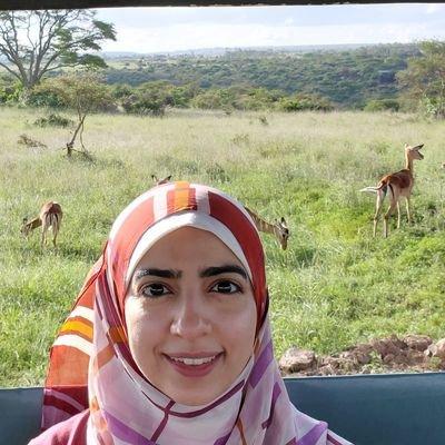 Malaysian Muslim traveler in a private safari vehicle in Uganda