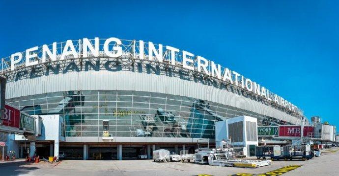 Travelers departing Penang International Airport for a Uganda safari